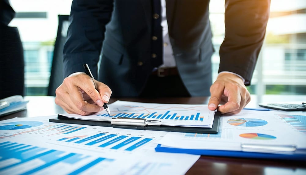 Professional accountants analyzing financial reports at Aureus Scale Professional accountants analyzing financial reports at Aureus Scale